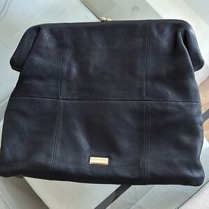 Coccinelle foldable black leather clutch